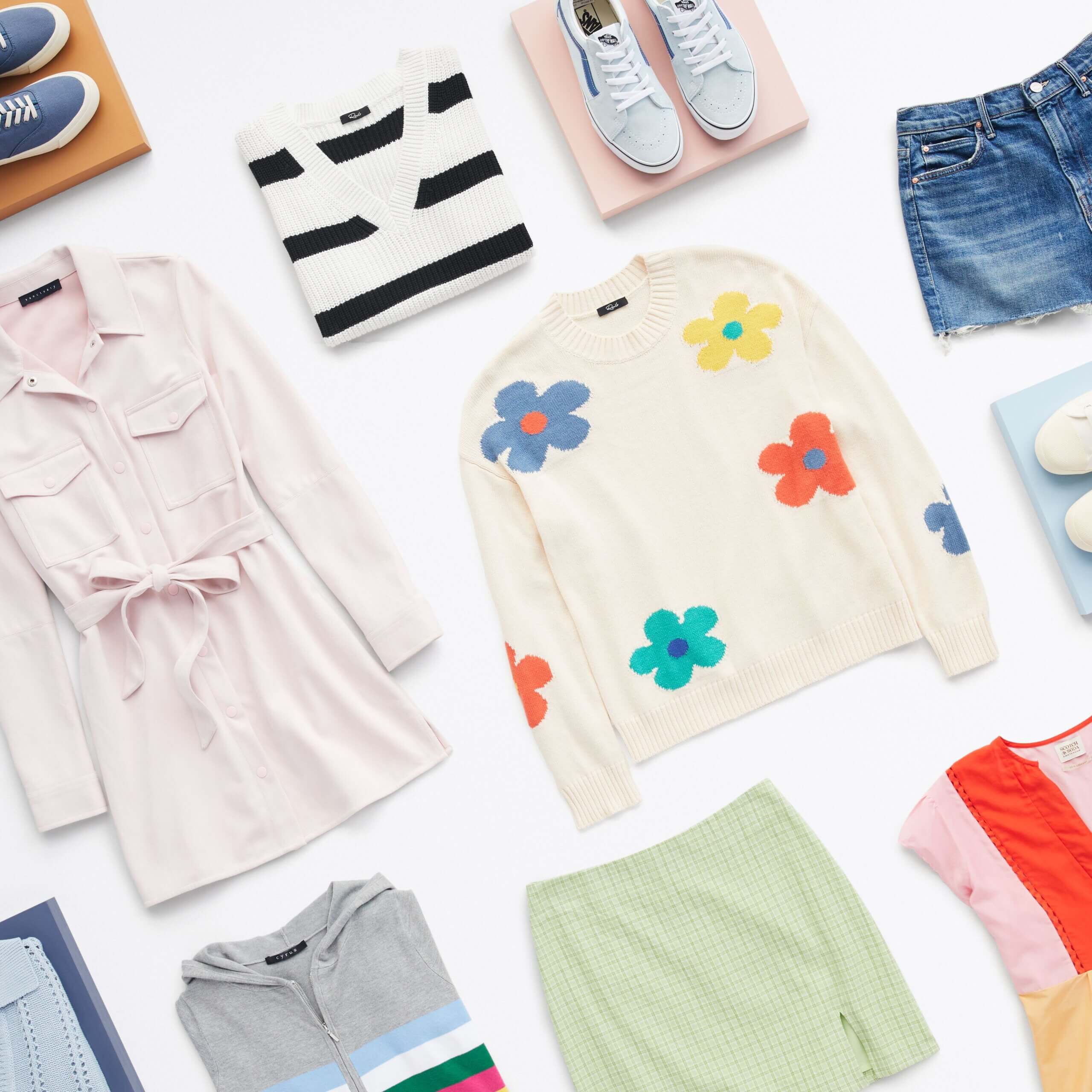 Stitch Fix women's Y2K fashion laydown with sweaters, sneakers, mini skirt, trench jacket, zip-up hoodie and denim shorts.