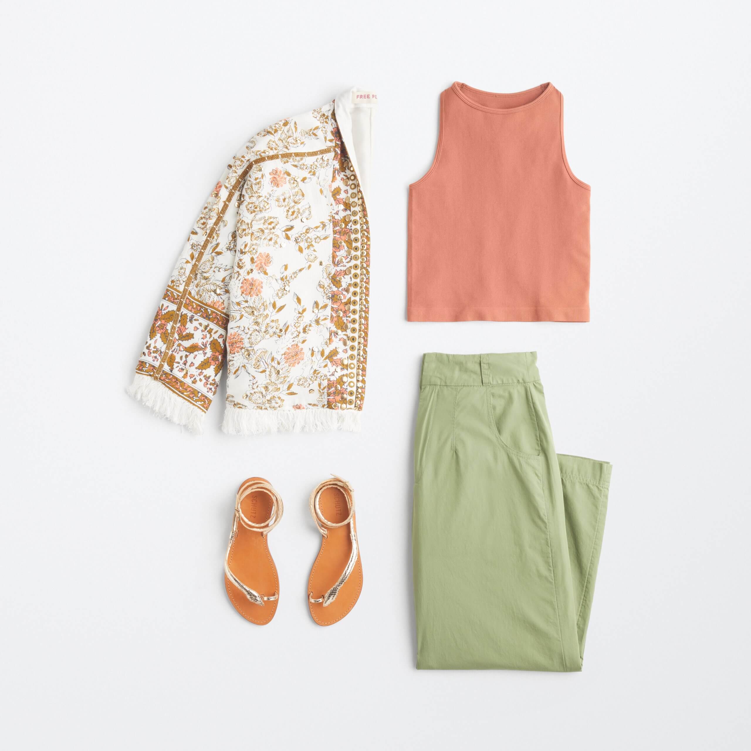 Stitch Fix women's 90s fashion outfit with burnt orange tank top, white boho print jacket, green pants and metallic sandals.