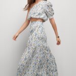 Stitch Fix model wearing women’s regencycore outfit featuring matching printed skirt and crop top with green block heel sandals.