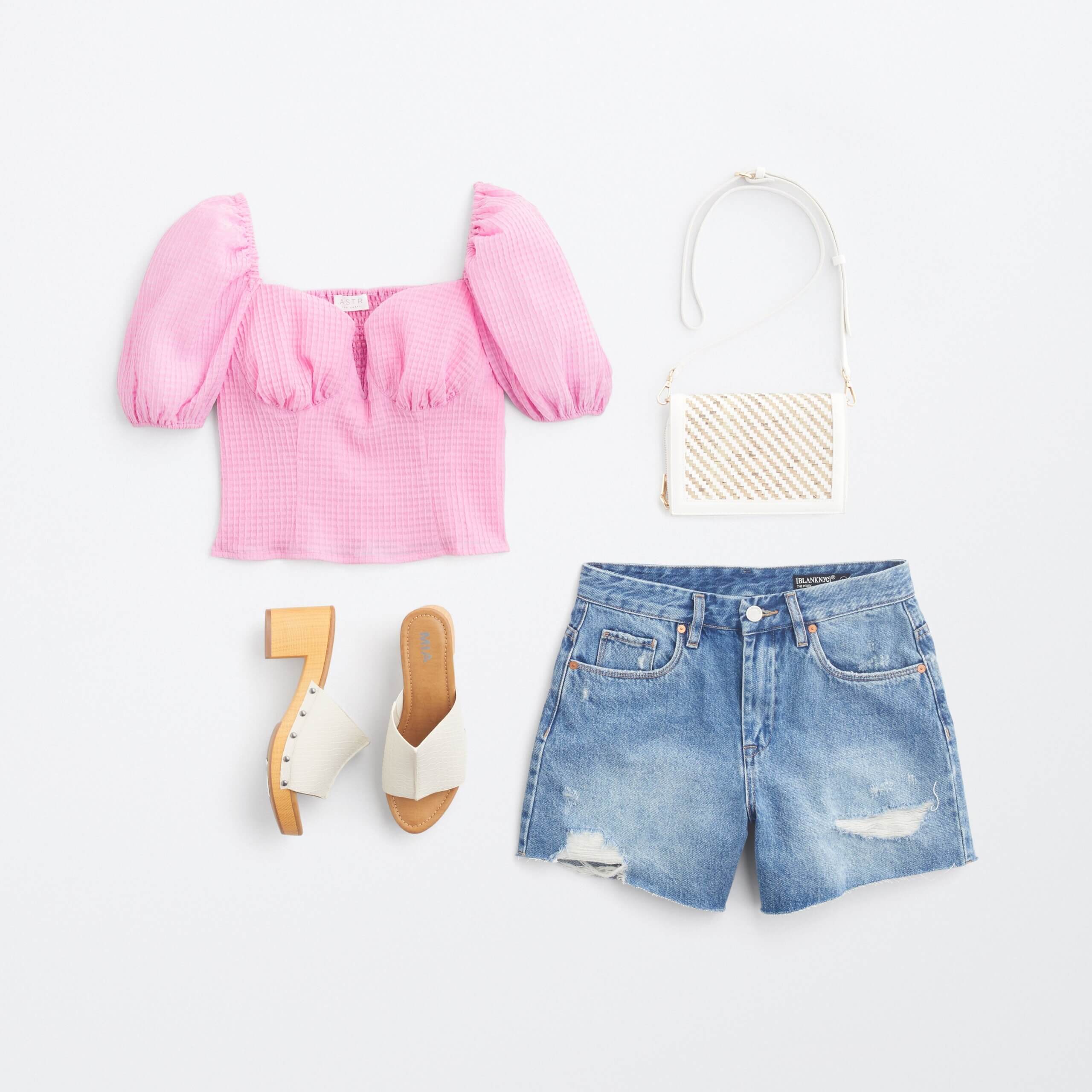 Stitch Fix women's Y2K fashion outfit with pink puffed-sleeve top, denim shorts, white bag and white heels with wooden sole.