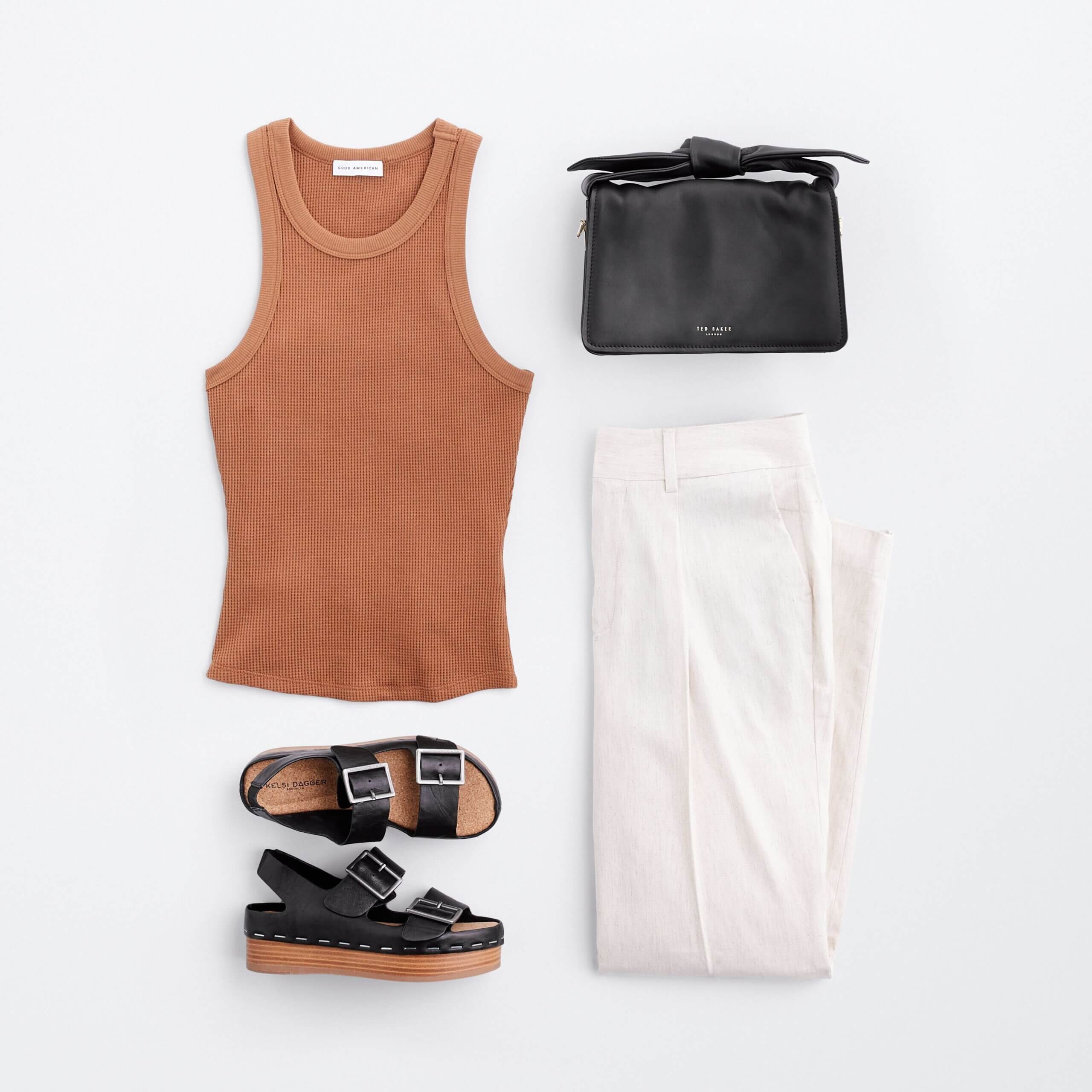 Stitch Fix women’s coastal grandmother outfit with white linen trousers, brown tank top, black sandals and black clutch.