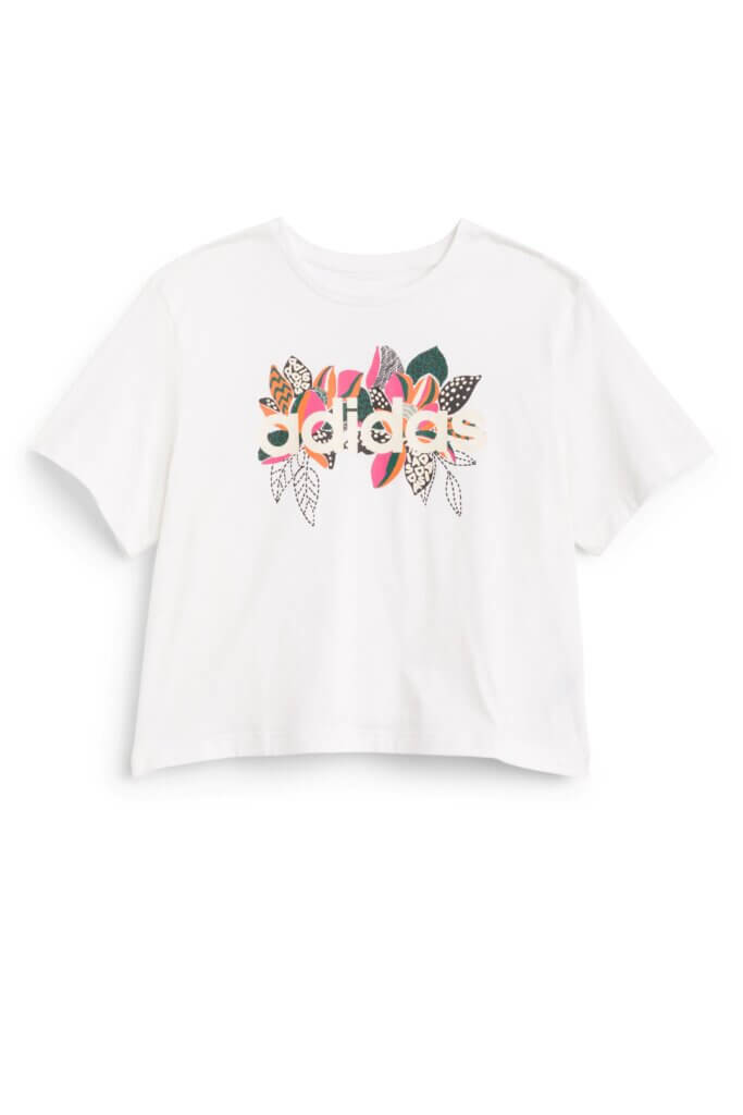 Stitch Fix women’s white T-shirt with colorful leaves outlining brand logo.
