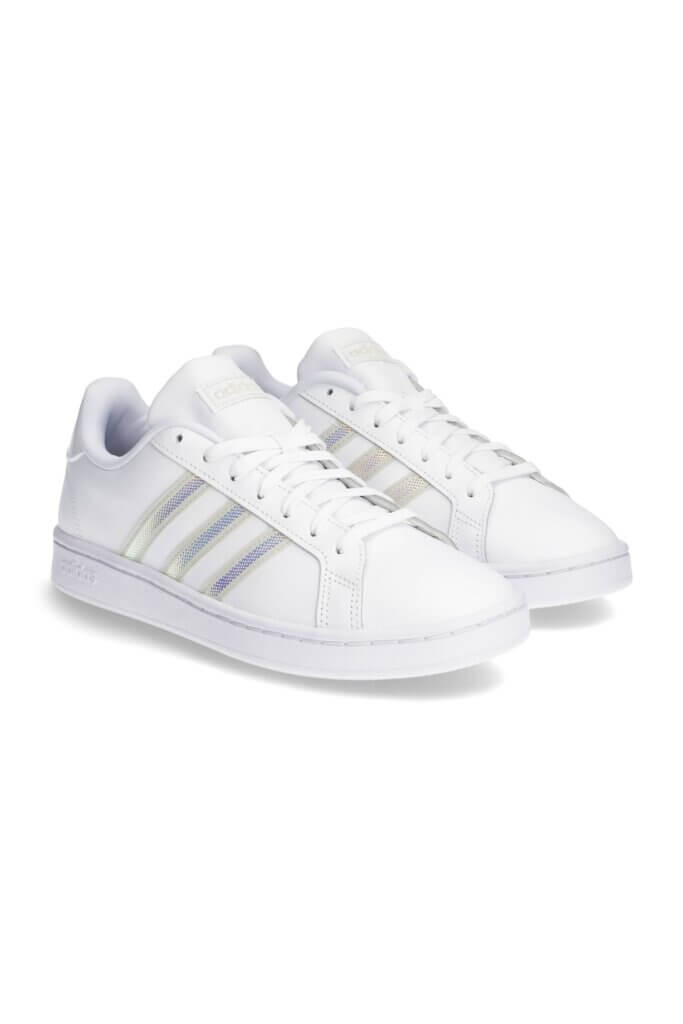 Stitch Fix women's white sneakers with silver stripe detailing.