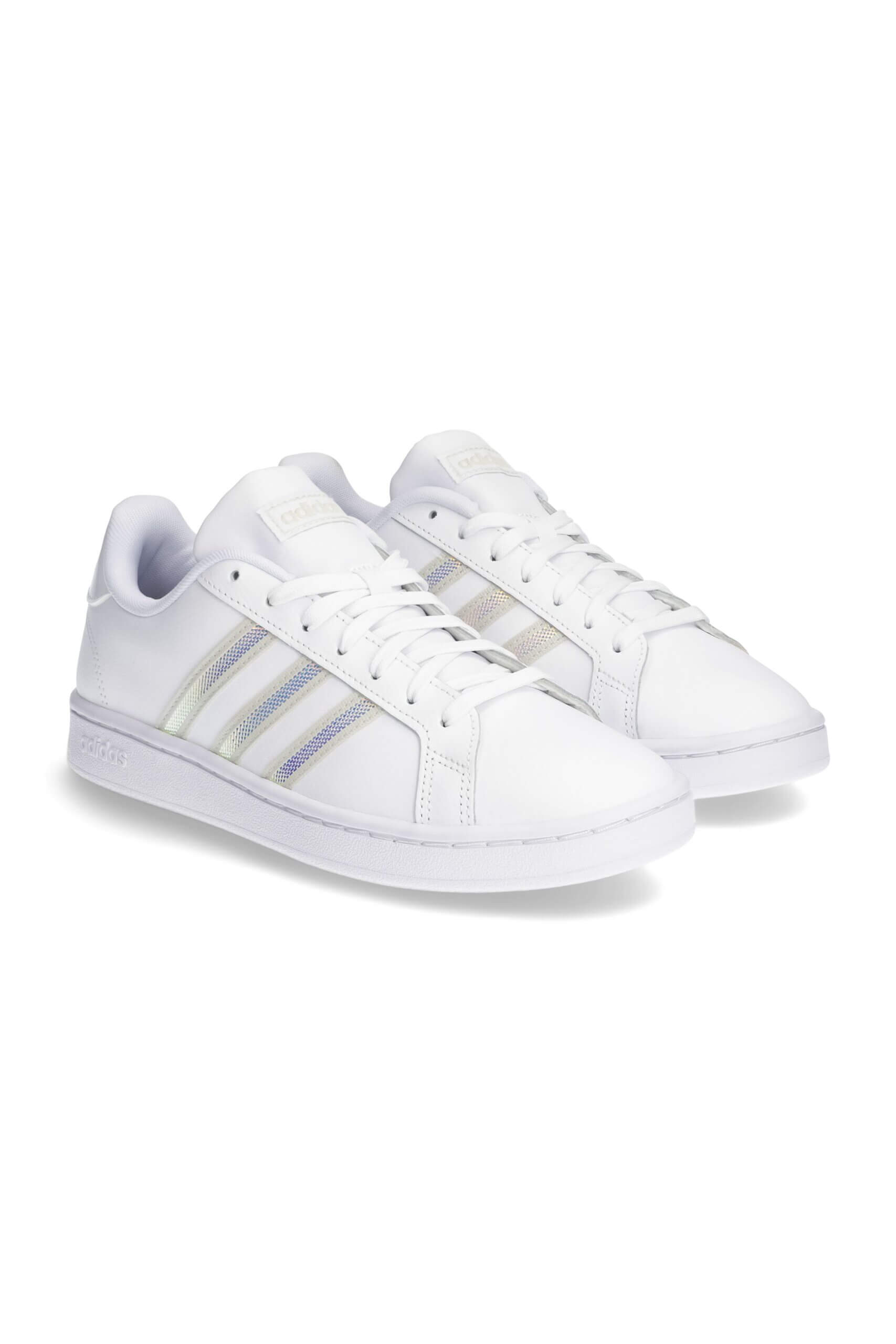 Stitch Fix women's white sneakers with silver stripe detailing.