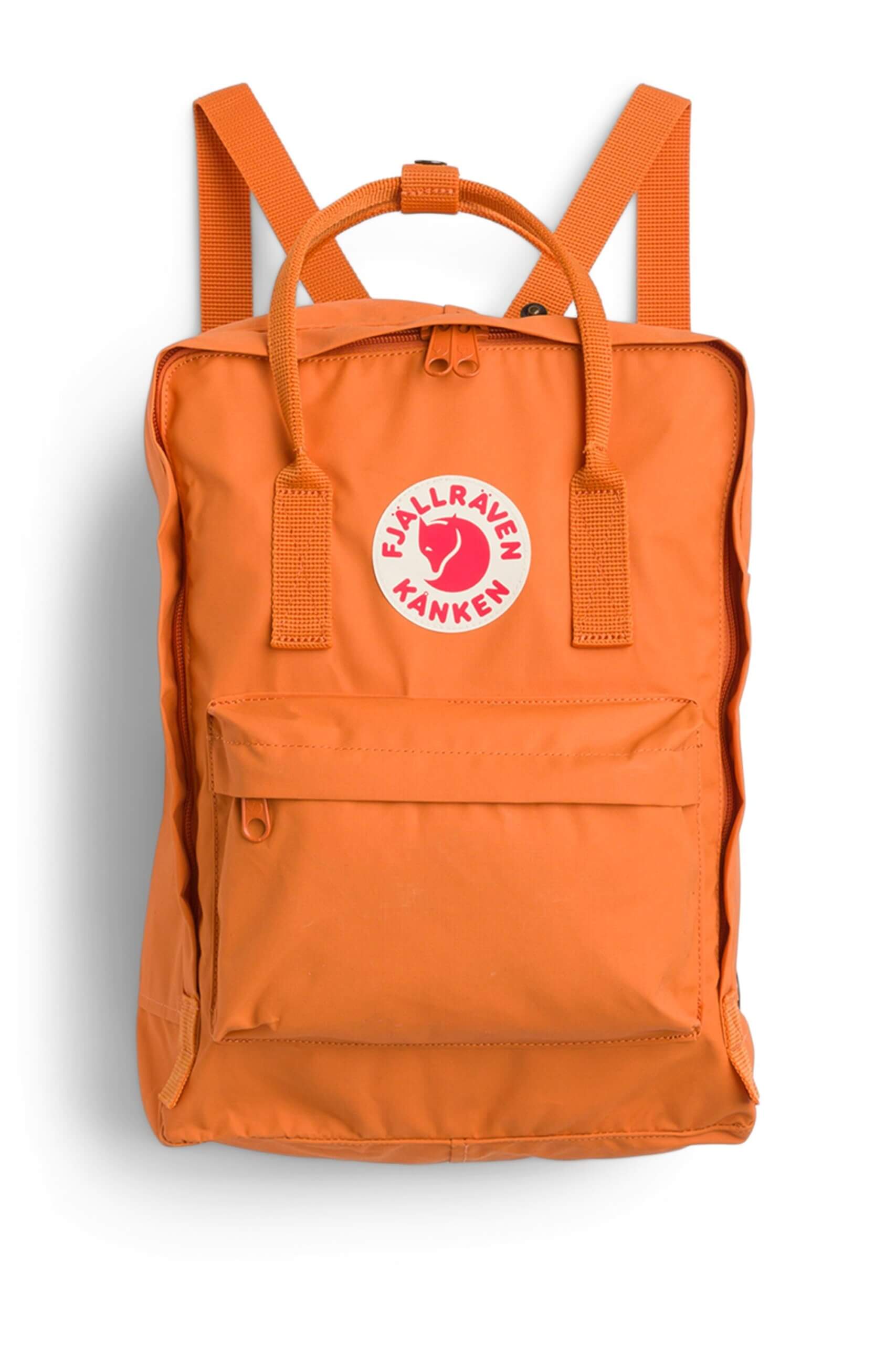 Stitch Fix women’s essential road trip packing list safety orange backpack with white and red brand logo.