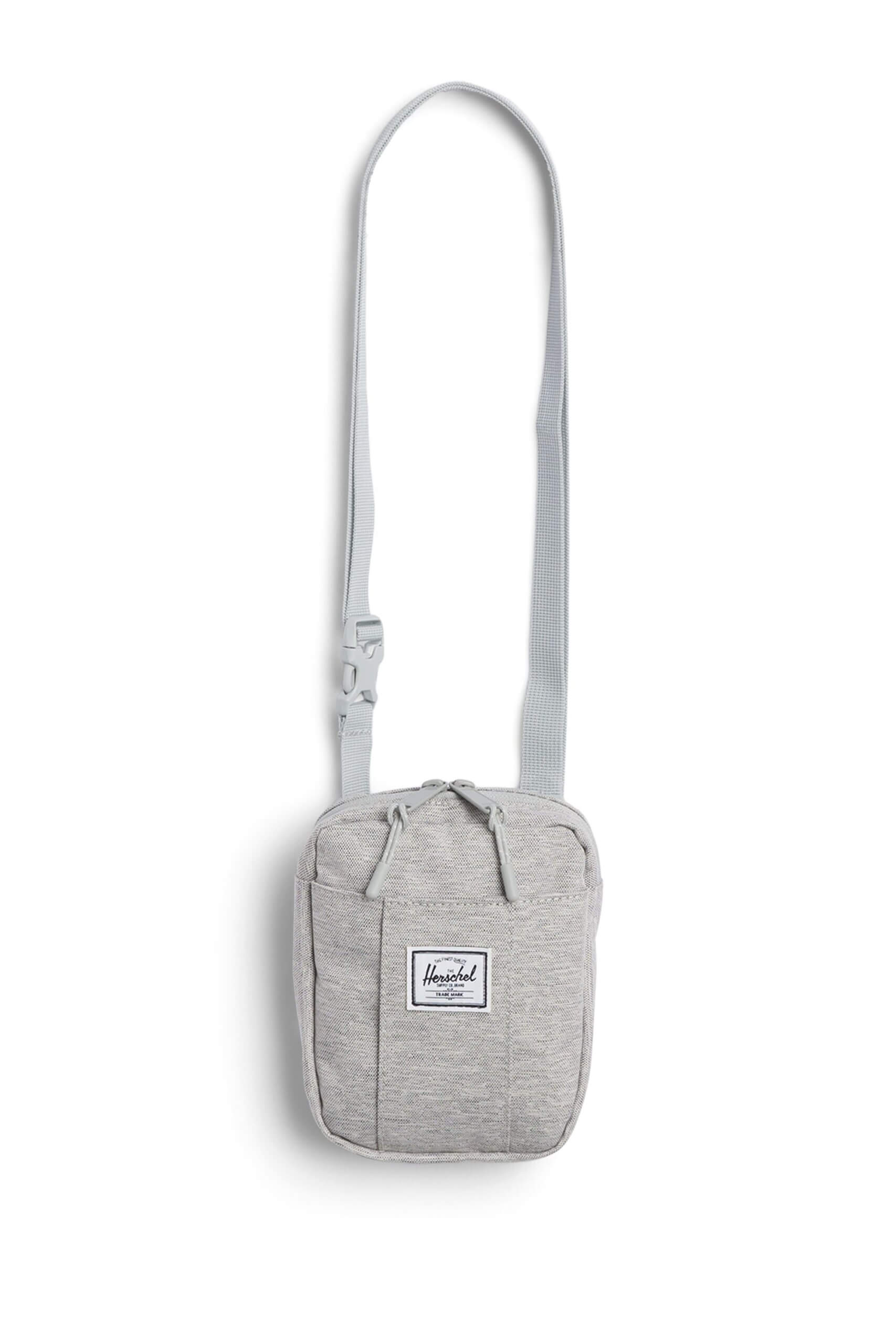 Stitch Fix women’s essential road trip packing list heather grey cross body bag with white and black brand logo.