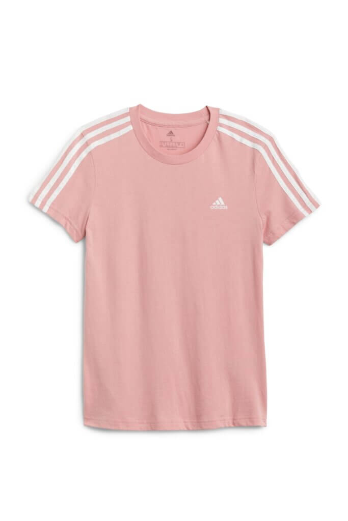 Stitch Fix women's pink short-sleeve tee with white stripes on shoulder and white brand logo.