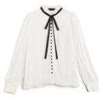 Stitch Fix women’s long-sleeved white button-down shirt with black buttons and black necktie detail.