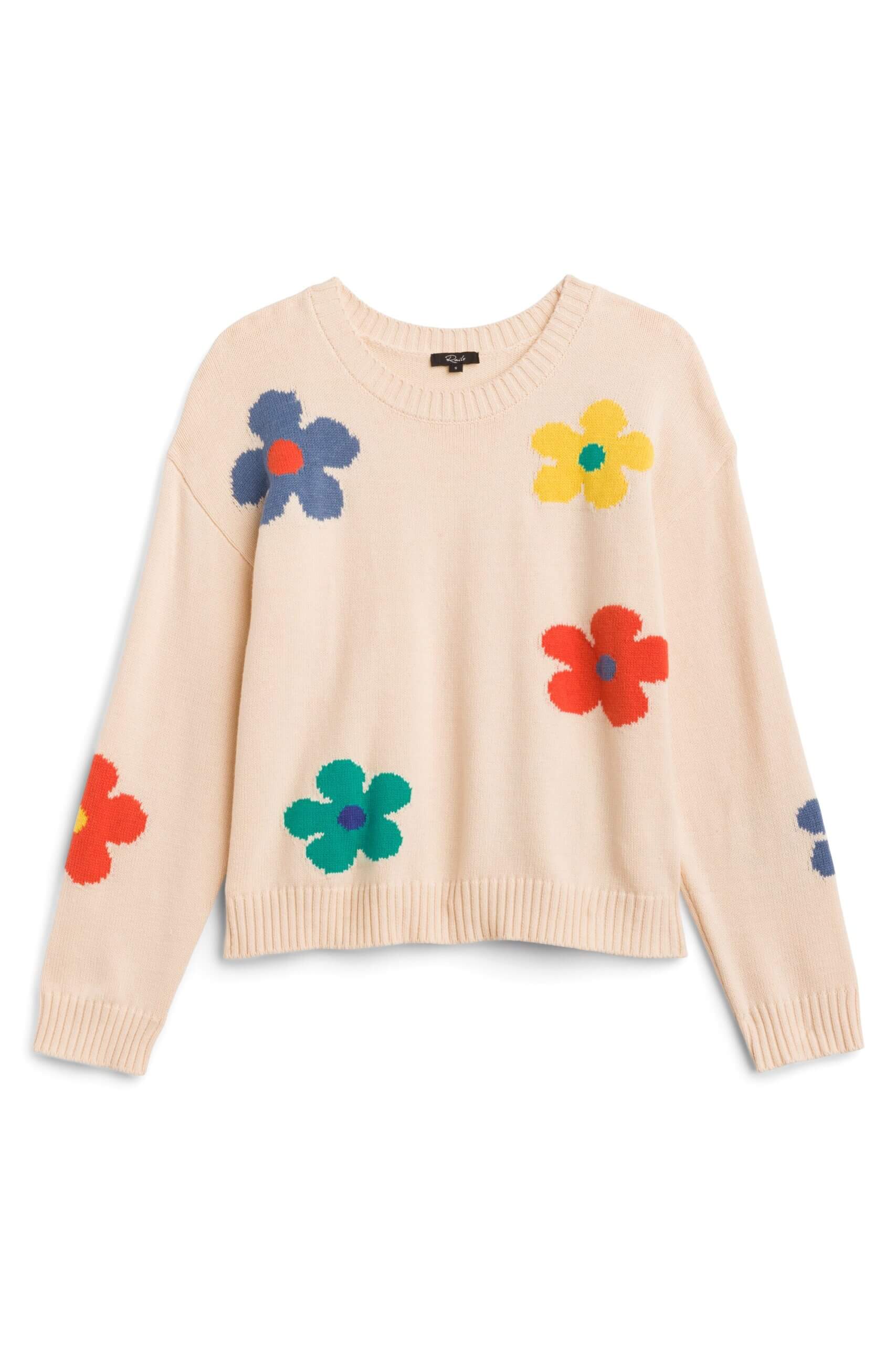 Stitch Fix women’s cream sweater with colorful flower detail.