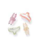 Stitch Fix women’s set of four purple, pink, green and yellow glitter plastic hair clips.