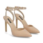 Stitch Fix women’s nude pointed-toe heels with grommet detail ankle straps.