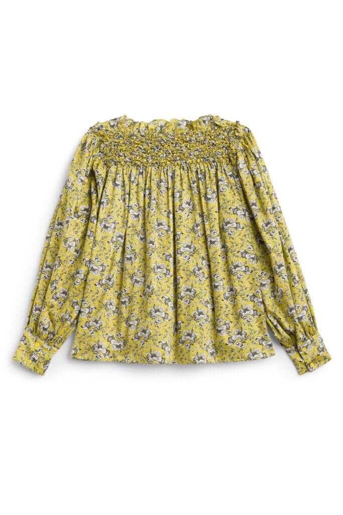 Stitch Fix women’s green floral long-sleeve top with smocking detail.