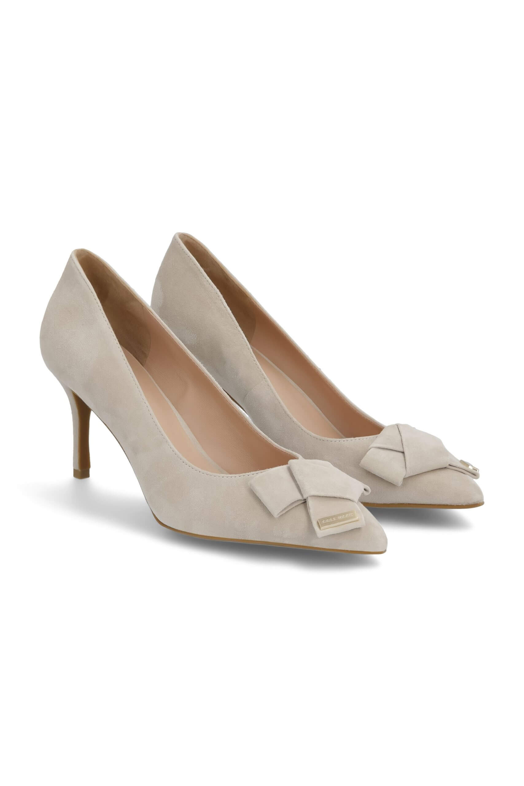 Stitch Fix women's beige pumps with bow detail on toes.