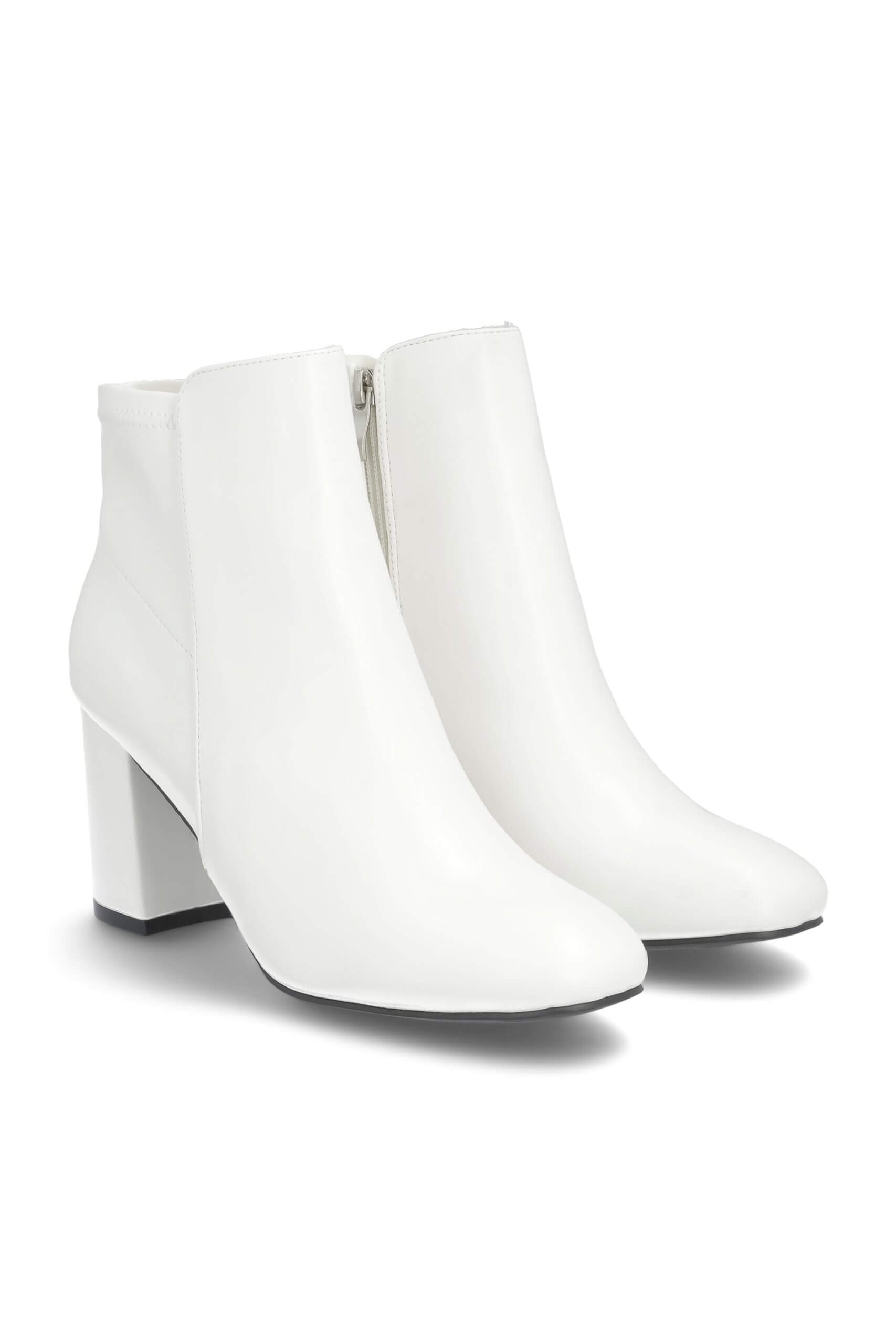 Stitch Fix women’s white booties with block heels.