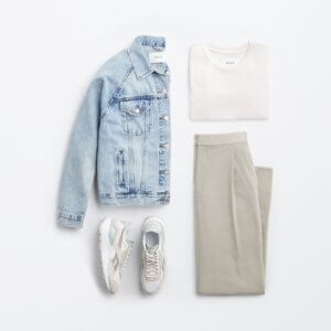 travel outfit for women with jean jacket, trousers, and jeans.