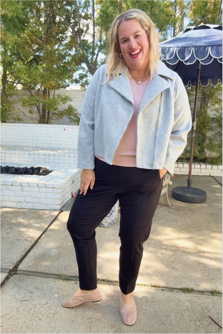 woman with oval body shape wearing v-neck shirt, blazer, and black pants