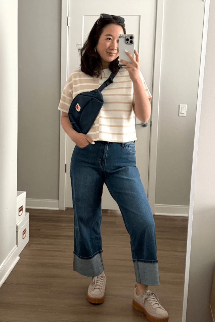 Mom in cuffed jeans outfit with saddle bag